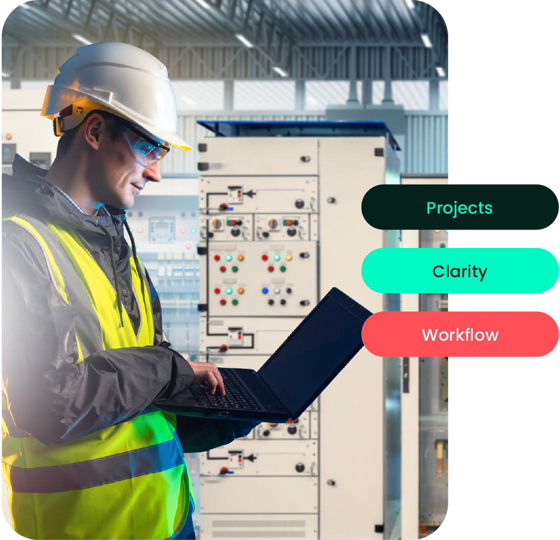 Energy operator working on a laptop in front of control panels